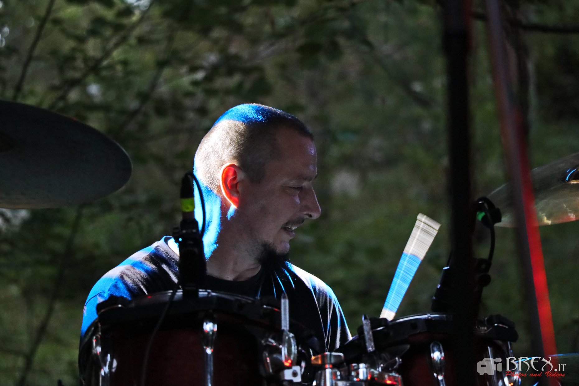 Drummer performing live on stage