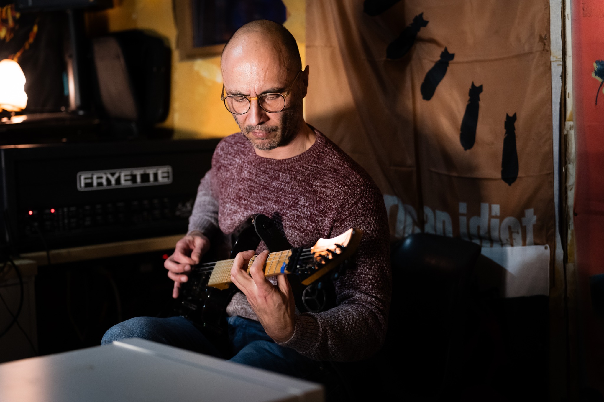 Guitarist playing in the rehearsal room